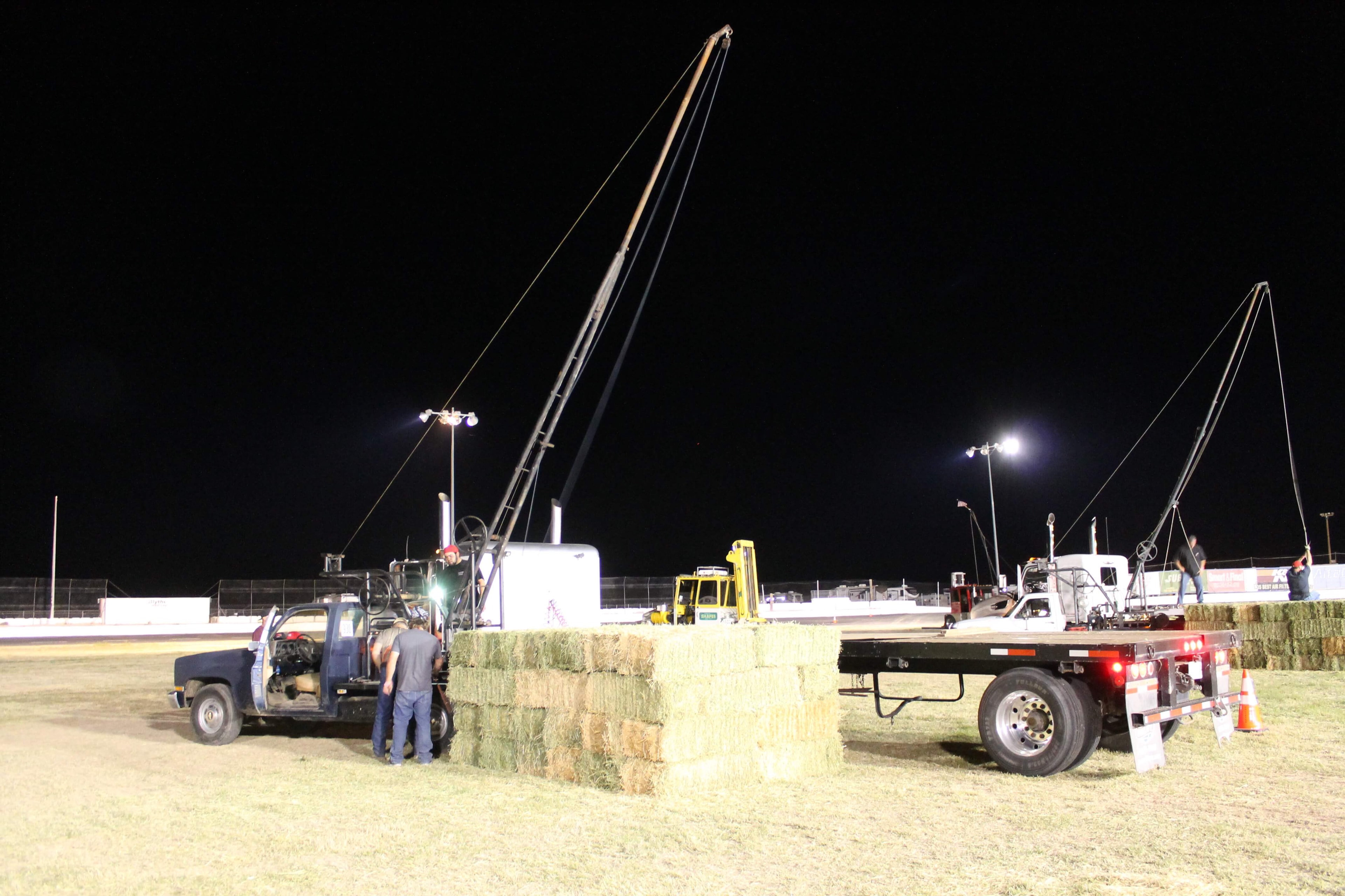 Boom Hay Loading event at night
