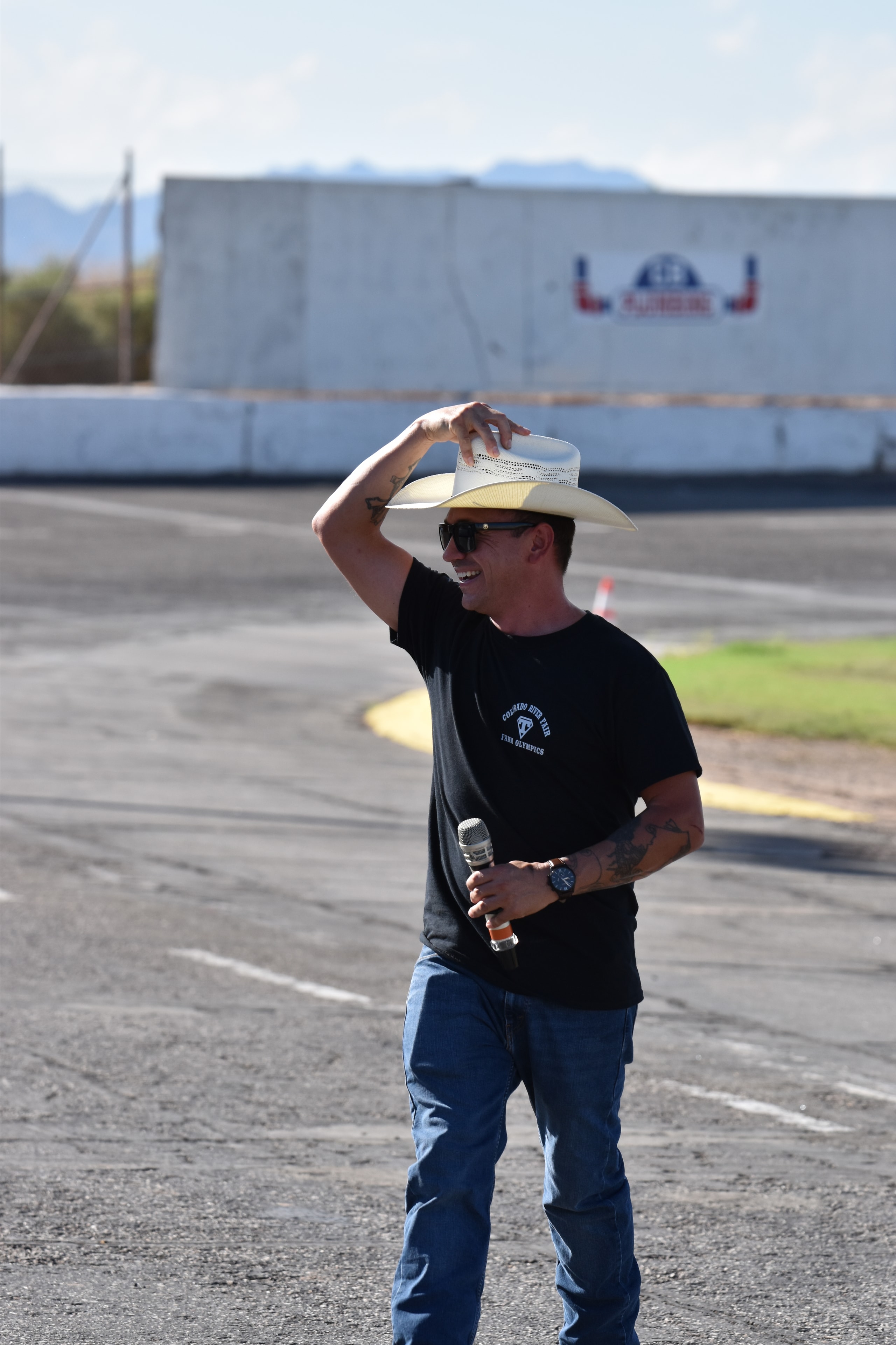 Emcee with cowboy hat at the Farm Olympics