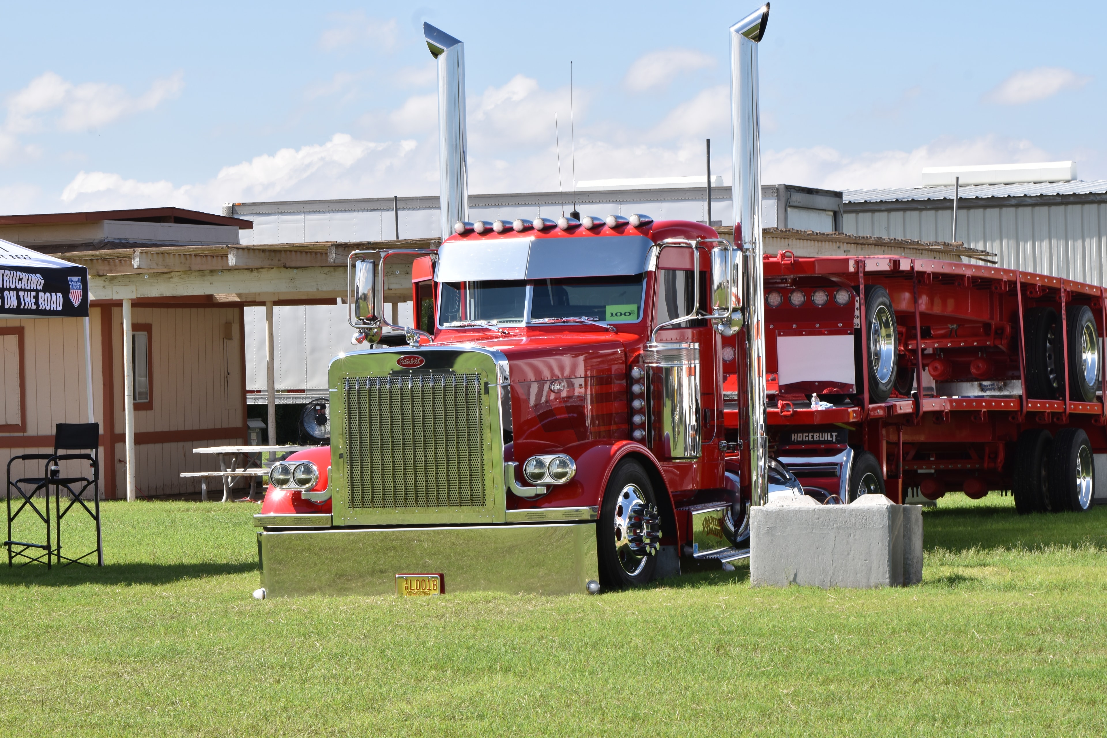 Red Peterbilt semi truck with chrome details at the Big Rig Truck Show