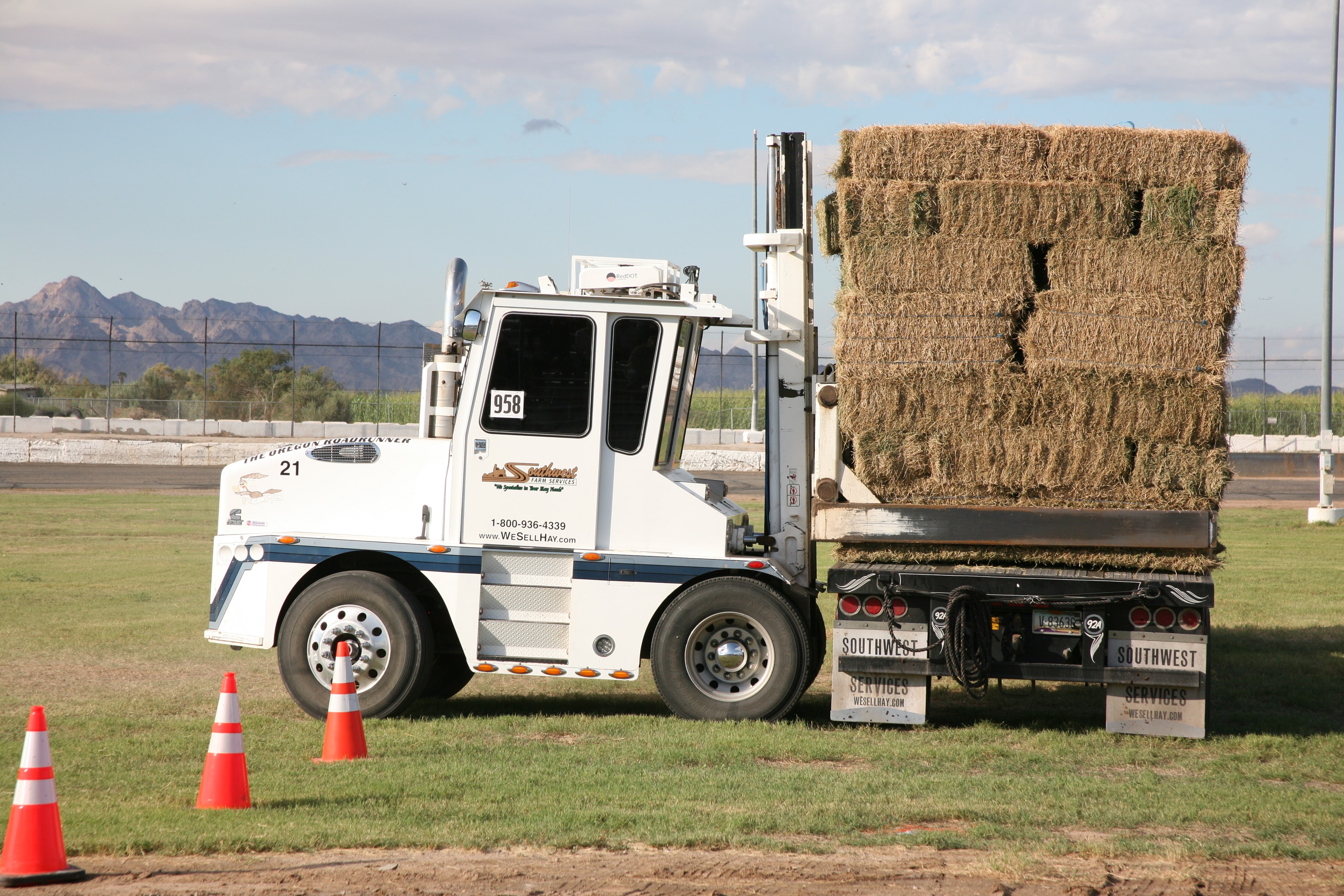 Southwest Farm Services hay truck loaded with bales at the Farm Olympics